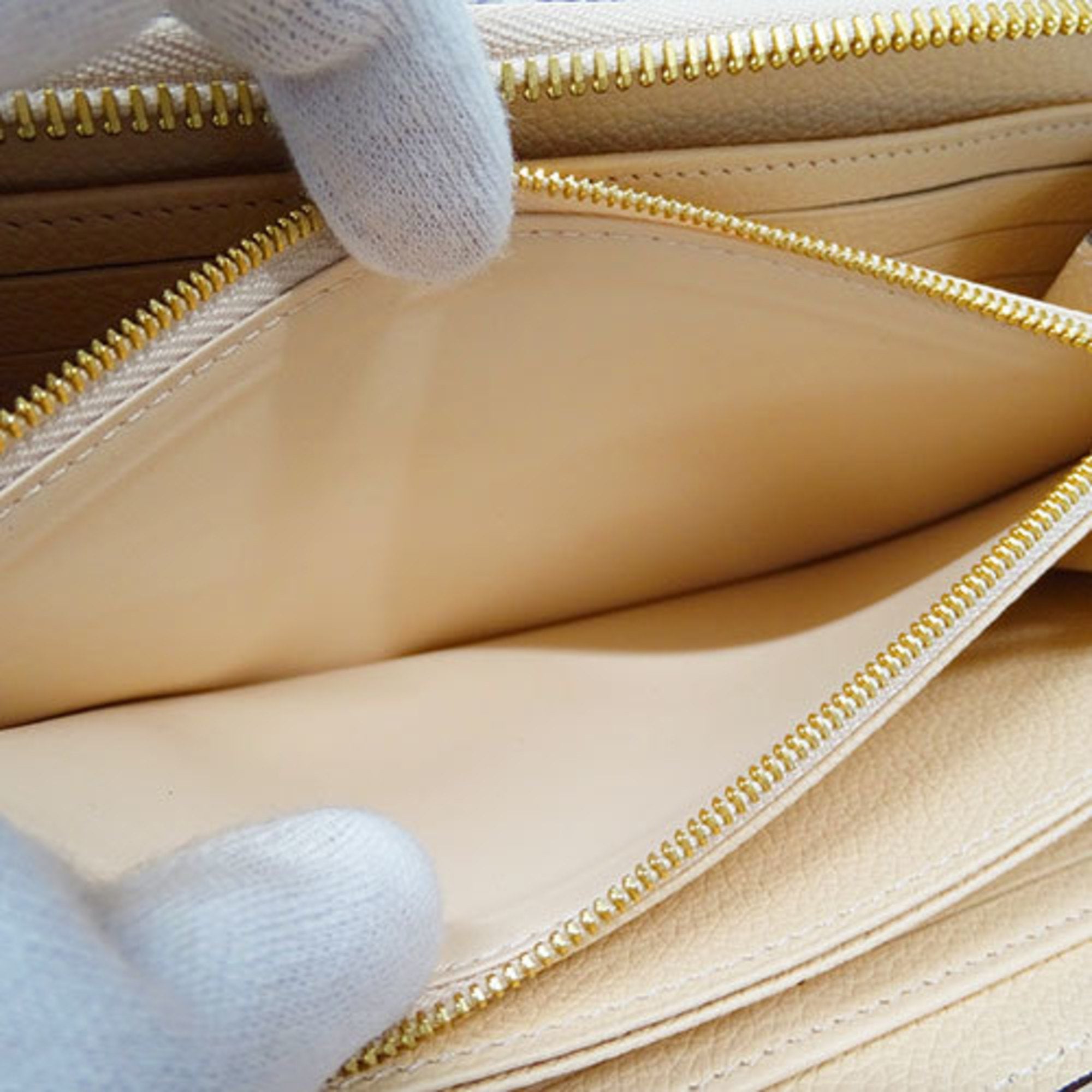 Louis Vuitton Long Monogram Empreinte Zippy Wallet Crème Light Beige M82212